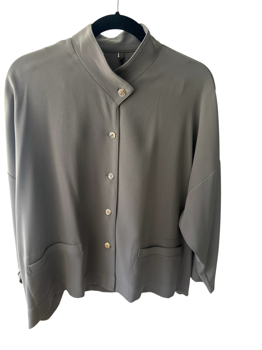 Blanque 2 piece boxy jacket and pull on pants. Color is a soft sage.